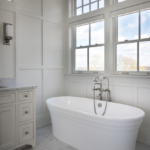 Beautiful soaking tub in bathroom with bright light and large windows