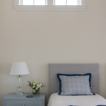 Guest bedroom vignette, bed, night stand, table lamp