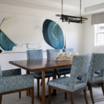 Dining room table, chairs, chendelier and art