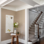 Stairwal with modern side table, vase and artwork