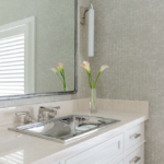 Bathroom vanity and mirror with vase