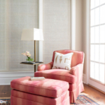 Comfortable pink chair with ottoman and modern side table