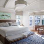 Bedroom with coffered ceiling and chandelier