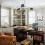 Study with desk, built in shelves, modern overhead light fixture