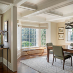 Dining room with modern organic style table by window