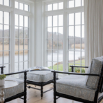 Chairs overlooking a beautiful view through large windows